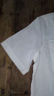 This is a NWT Michael Kors white linen shirt. It is short sleeved and 