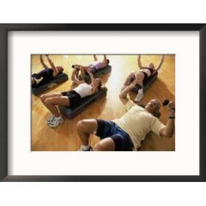  High Angle View of a Group of People Exercising in a Step 