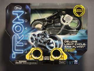   TRON LEGACY DELUXE SAM FLYNN LIGHT CYCLE WITH AIR BRAKES SERIES 1 NEW