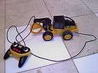 REMOTE CONTROL CAT BULL DOZER OR CRANE THING TOY WORKS GOOD !