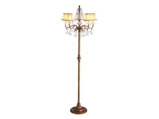 This traditional floor lamp has an ornate chandelier style top and 