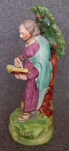   CENTURY STAFFORDSHIRE PEARLWARE FIGURE OF ST. MARK WITH LION AT FEET