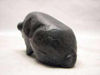 nice primitive cast iron pig paper weight. Has some remaining black 