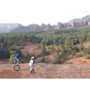  Two Men on Unicycles Ride a Rocky Ridge in the Arizona 